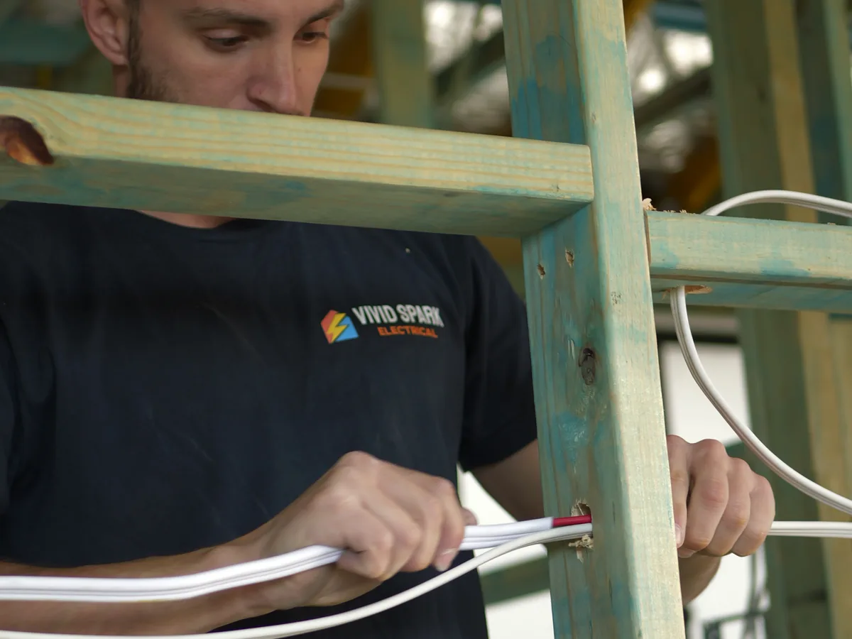 Vivid Spark electrician reviewing plans on a construction site